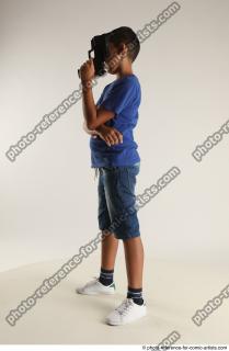 TIMBO STANDING POSE WITH GUN